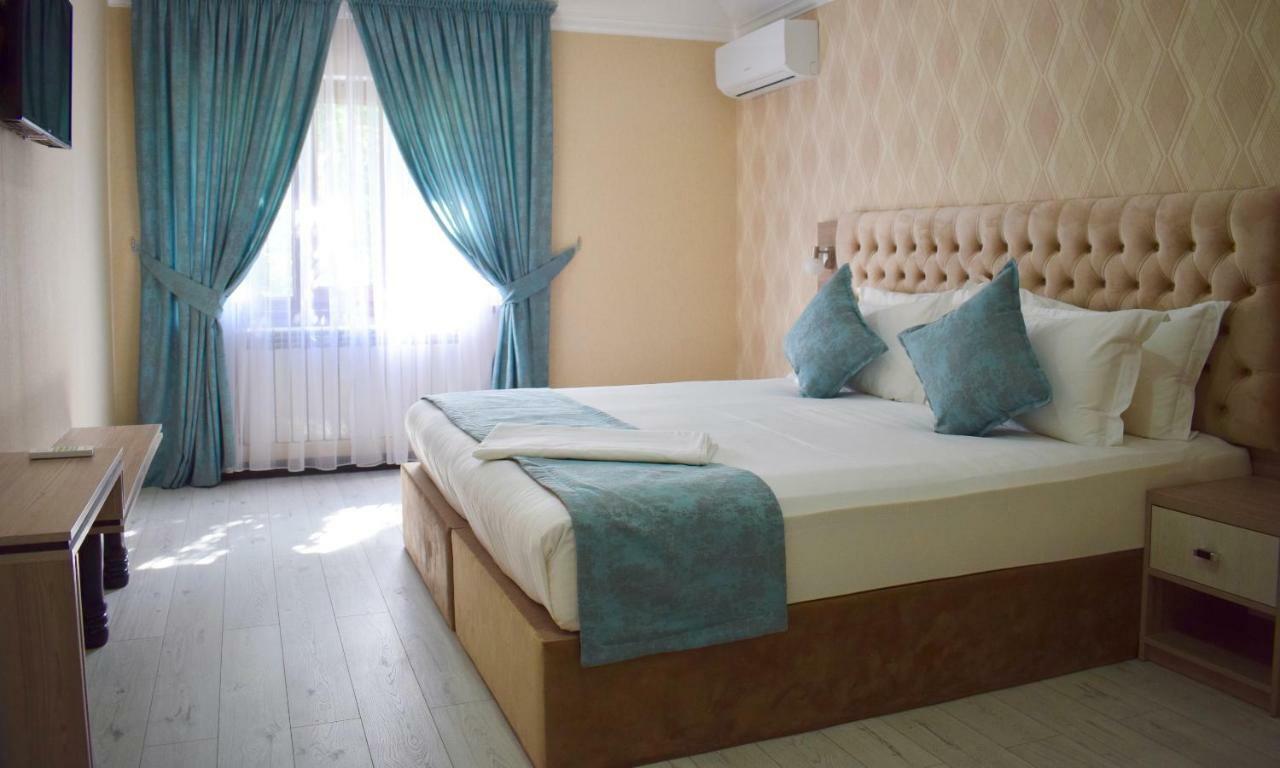 Dostar Inn Shymkent Esterno foto